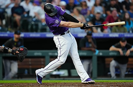 Aug 6, 2021; Denver, Colorado, USA; Colorado Rockies first baseman C.J. Cron (25) hits a three run home run during the fourth inning inning against the against the Miami Marlins at Coors Field. Mandatory Credit: Ron Chenoy-USA TODAY Sports