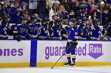 Nov 22, 2021; St. Louis, Missouri, USA;  St. Louis Blues center Tyler Bozak (21) is congratulated by teammates after scoring against the Vegas Golden Knights during the first period at Enterprise Center. Mandatory Credit: Jeff Curry-USA TODAY Sports