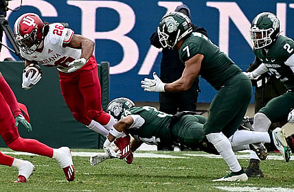 Nov 19, 2022; East Lansing, Michigan, USA;  Michigan State Spartans safety Khalil Majeed (34) tackles Indiana Hoosiers running back Josh Henderson (26) in the second quarter at Spartan Stadium. Mandatory Credit: Dale Young-USA TODAY Sports