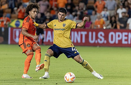 Aug 23, 2023; Houston, TX, USA; Houston Dynamo midfielder Adalberto Carrasquilla (20) passes against Real Salt Lake defender Brayan Vera (4) in the second half at Shell Energy Stadium. Mandatory Credit: Thomas Shea-USA TODAY Sports