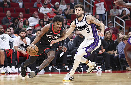 Nov 4, 2023; Houston, Texas, USA; Houston Rockets guard Jalen Green (4) drives with the ball as Sacramento Kings guard Chris Duarte (3) defends during the first quarter at Toyota Center. Mandatory Credit: Troy Taormina-USA TODAY Sports