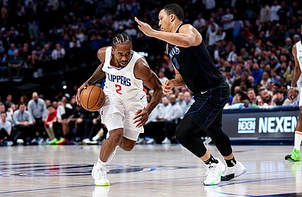 Dec 20, 2023; Dallas, Texas, USA;  LA Clippers forward Kawhi Leonard (2) controls the ball as Dallas Mavericks forward Grant Williams (3) defends during the second half at American Airlines Center. Mandatory Credit: Kevin Jairaj-USA TODAY Sports