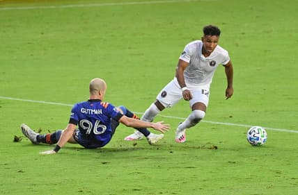 Nov 8, 2020; Fort Lauderdale, FL, Fort Lauderdale, FL, USA; Inter Miami CF forward Juan Agudelo (12) controls the ball around FC Cincinnati defender Andrew Gutman (96) during the second half at Inter Miami CF Stadium. Mandatory Credit: Jasen Vinlove-USA TODAY Sports
