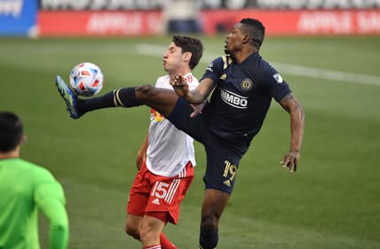 May 15, 2021; Philadelphia, Pennsylvania, USA; Philadelphia Union forward Cory Burke (19) jumps for the ball over New York Red Bulls defender Sean Nealis (15) in the first half at Subaru Park. Mandatory Credit: Kyle Ross-USA TODAY Sports