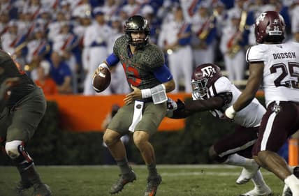 Oct 14, 2017; Gainesville, FL, USA;Florida Gators quarterback Feleipe Franks (13) runs out of the pocket as Texas A&M Aggies defensive end Michael Clemons (48) pressures  during the first half at Ben Hill Griffin Stadium. Mandatory Credit: Kim Klement-USA TODAY Sports