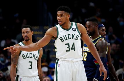 Nov 26, 2021; Denver, Colorado, USA; Milwaukee Bucks forward Giannis Antetokounmpo (34) reacts to a score in the second half against the Denver Nuggets at Ball Arena. Mandatory Credit: Ron Chenoy-USA TODAY Sports