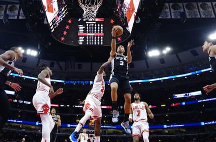 Feb 14, 2022; Chicago, Illinois, USA; Chicago Bulls forward Javonte Green (24) defends San Antonio Spurs forward Keldon Johnson (3) during the first half at United Center. Mandatory Credit: David Banks-USA TODAY Sports