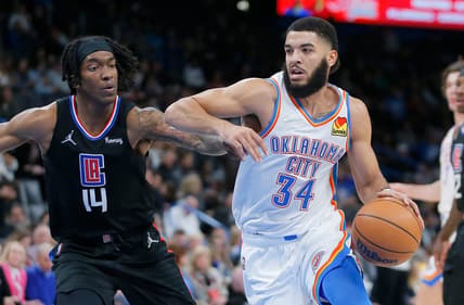 Thunder forward Kenrich Williams (34) goes past Clippers guard Terance Mann (14) during Oklahoma City's 104-103 win at Paycom Center on Dec. 18.

thunder2