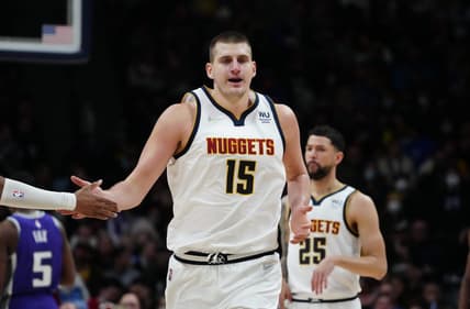 Jan 7, 2022; Denver, Colorado, USA; Denver Nuggets center Nikola Jokic (15) celebrates a score in the second half against the Sacramento Kings at Ball Arena. Mandatory Credit: Ron Chenoy-USA TODAY Sports
