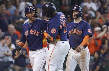 Sep 18, 2022; Houston, Texas, USA; Houston Astros catcher Martin Maldonado (15) celebrates with first baseman Yuli Gurriel (10) after hitting a home run during the seventh inning against the Oakland Athletics at Minute Maid Park. Mandatory Credit: Troy Taormina-USA TODAY Sports