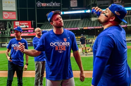 Sep 19, 2022; Milwaukee, Wisconsin, USA; New York Mets pitcher Max Scherzer (21) celebrates with designated hitter Daniel Vogelbach (32) after the Mets clinched a playoff spot by beating the Milwaukee Brewers at American Family Field. Mandatory Credit: Benny Sieu-USA TODAY Sports