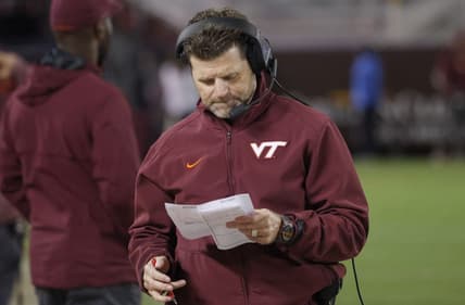 Sep 22, 2022; Blacksburg, Virginia, USA; Virginia Tech Hokies head coach Brent Pry checks his charts during the second half against the West Virginia Mountaineers at Lane Stadium. Mandatory Credit: Reinhold Matay-USA TODAY Sports