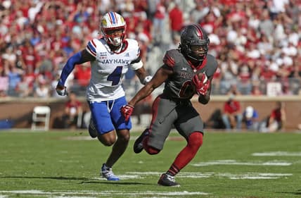 Oct 15, 2022; Norman, Oklahoma, USA;  Oklahoma Sooners running back Eric Gray (0) runs with the ball as Kansas Jayhawks safety Marvin Grant (4) chases during the first half at Gaylord Family-Oklahoma Memorial Stadium. Mandatory Credit: Kevin Jairaj-USA TODAY Sports