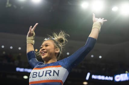 Auburn's Suni Lee reacts after her vault performance as Auburn Tigers gymnastics takes on Florida Gators at Neville Arena in Auburn, Ala., on Saturday, March 5, 2022. Auburn Tigers and Florida Gators ended in a tie at 198.575.