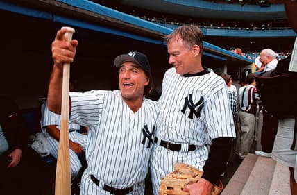From left, former New York Yankees Joe Pepitone and Jim Bouton share some laughs before action in the Old-Timers' Game against the Los Angeles Dodgers at Yankee Stadium on July 25, 1998.

24019207 00006