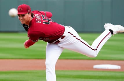 Arizona Diamondbacks starting pitcher Tommy Henry (47) makes his warm-up throws before facing the San Francisco Giants in the first inning during a spring training game at Salt River Fields in Scottsdale on March 14, 2023.

Mlb Giants At Diamondbacks