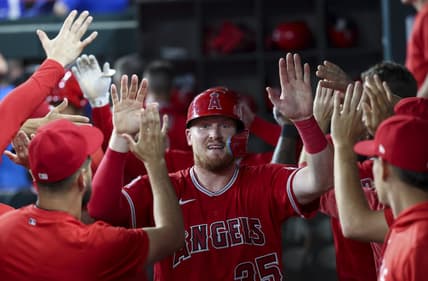 Jun 13, 2023; Arlington, Texas, USA;  Los Angeles Angels catcher Chad Wallach (35) celebrates with teammates after scoring during the third inning against the Texas Rangers at Globe Life Field. Mandatory Credit: Kevin Jairaj-USA TODAY Sports