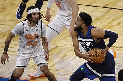 May 9, 2021; Orlando, Florida, USA; Minnesota Timberwolves center Karl-Anthony Towns (32) drives to the basket as Orlando Magic guard Cole Anthony (50) defends during the second half at Amway Center. Mandatory Credit: Kim Klement-USA TODAY Sports