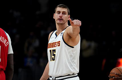 Nov 18, 2021; Denver, Colorado, USA; Denver Nuggets center Nikola Jokic (15) reacts during the first quarter against the Philadelphia 76ers at Ball Arena. Mandatory Credit: Ron Chenoy-USA TODAY Sports