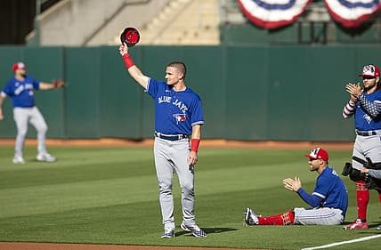 Jul 4, 2022; Oakland, California, USA; Toronto Blue Jays third baseman Matt Chapman (26) acknowledges the cheers of fans of his former team, the Oakland Athletics, before a game at RingCentral Coliseum. Mandatory Credit: D. Ross Cameron-USA TODAY Sports