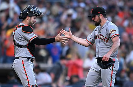 Jul 9, 2022; San Diego, California, USA; San Francisco Giants starting pitcher Carlos Rodon (right) celebrates with catcher Austin Wynns (left) after the Giants defeated the San Diego Padres at Petco Park. Mandatory Credit: Orlando Ramirez-USA TODAY Sports