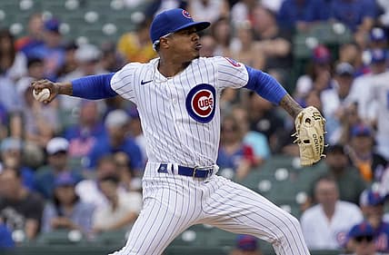 Jul 16, 2022; Chicago, Illinois, USA; Chicago Cubs starting pitcher Marcus Stroman (0) throws against the New York Mets during the first inning in game one of a doubleheader at Wrigley Field. Mandatory Credit: David Banks-USA TODAY Sports