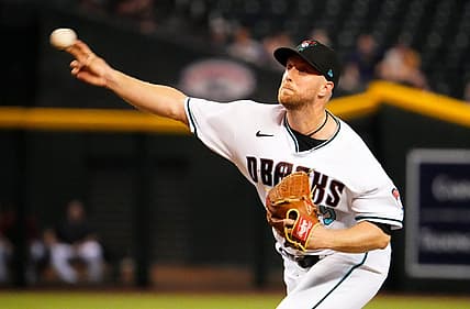 Sep 1, 2022; Phoenix, Arizona, USA; Arizona Diamondbacks starting pitcher Merrill Kelly (29) throws to the Milwaukee Brewers in the first inning at Chase Field. Mandatory Credit: Rob Schumacher-Arizona Republic

Mlb Brewers At Diamondbacks
