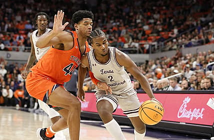 Nov 18, 2022; Auburn, Alabama, USA;  Auburn Tigers center Dylan Cardwell (44) blocks Texas Southern Tigers forward Davon Barnes (2) during the first half at Neville Arena. Mandatory Credit: John Reed-USA TODAY Sports