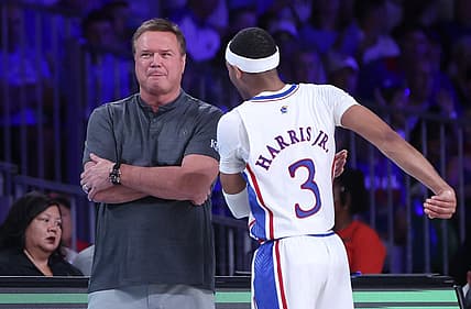 Nov 24, 2022; Paradise Island, BAHAMAS; Kansas Jayhawks head coach Bill Self speaks with Kansas Jayhawks guard Dajuan Harris Jr. (3) during the first half against the Wisconsin Badgers at Imperial Arena. Mandatory Credit: Kevin Jairaj-USA TODAY Sports