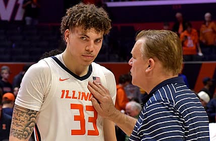 Nov 29, 2022; Champaign, Illinois, USA; Illinois Fighting Illini head coach Brad Underwood congratulates player Coleman Hawkins after his triple-double after a 73-44 win over the Syracuse Orange at State Farm Center. Mandatory Credit: Ron Johnson-USA TODAY Sports