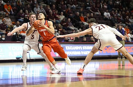 Jan 4, 2023; Blacksburg, Virginia, USA; Clemson Tigers guard Chase Hunter (1) drives to basket between Virginia Tech Hokies guard Sean Pedulla (3) and forward Grant Basile (21)  in the first halfat Cassell Coliseum. Mandatory Credit: Lee Luther Jr.-USA TODAY Sports