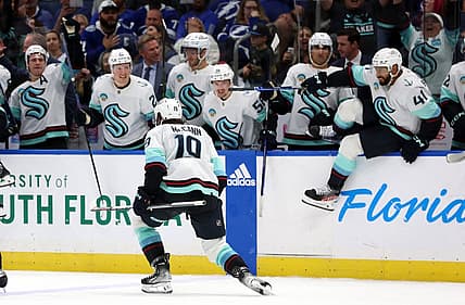 Oct 30, 2023; Tampa, Florida, USA; Seattle Kraken left wing Jared McCann (19) celebrates with teammates after they beat the Tampa Bay Lightning during overtime at Amalie Arena. Mandatory Credit: Kim Klement Neitzel-USA TODAY Sports