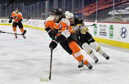 Feb 5, 2021; Philadelphia, Pennsylvania, USA; Philadelphia Flyers defenseman Ivan Provorov (9) carries the puck against the Boston Bruins at Wells Fargo Center. Mandatory Credit: Eric Hartline-USA TODAY Sports