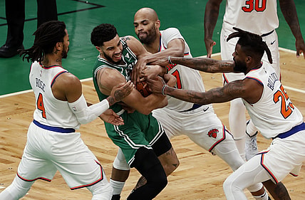 Apr 7, 2021; Boston, Massachusetts, USA; Boston Celtics forward Jayson Tatum (0) battles for the ball with New York Knicks guard Derrick Rose (4), center Taj Gibson (67) and New York Knicks forward Reggie Bullock (25) during the second quarter at TD Garden. Mandatory Credit: Winslow Townson-USA TODAY Sports