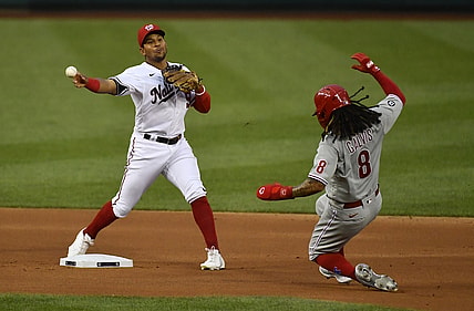 Aug 31, 2021; Washington, District of Columbia, USA; Washington Nationals second baseman Adrian Sanchez (9) turns a double play over Philadelphia Phillies shortstop Freddy Galvis (8) at Nationals Park. Mandatory Credit: Brad Mills-USA TODAY Sports