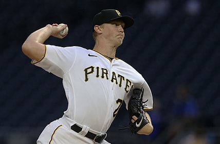 Sep 15, 2021; Pittsburgh, Pennsylvania, USA;  Pittsburgh Pirates starting pitcher Mitch Keller (23) delivers against the Cincinnati Reds during the first inning at PNC Park. Mandatory Credit: Charles LeClaire-USA TODAY Sports