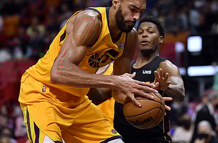 Nov 6, 2021; Miami, Florida, USA; Utah Jazz center Rudy Gobert (27) tries to keep possession of the ball against Miami Heat guard Kyle Lowry (7) during the first half at FTX Arena. Mandatory Credit: Jim Rassol-USA TODAY Sports