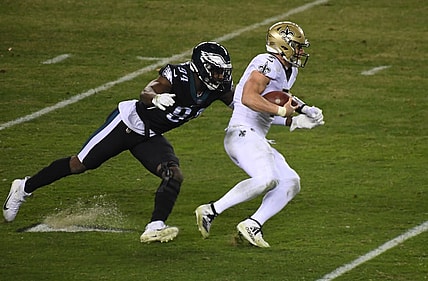 Dec 13, 2020; Philadelphia, Pennsylvania, USA; quarterback Taysom Hill (7) is chased by Philadelphia Eagles defensive end Josh Sweat (94) in the fourth quarter at Lincoln Financial Field. Mandatory Credit: James Lang-USA TODAY Sports
