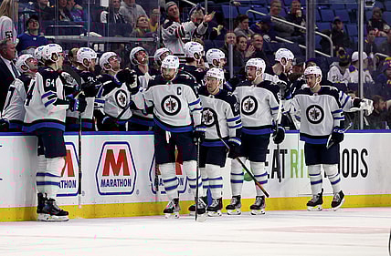 Mar 30, 2022; Buffalo, New York, USA;  Winnipeg Jets right wing Blake Wheeler (26) celebrates his goal during the second period with teammates against the Buffalo Sabres at KeyBank Center. Mandatory Credit: Timothy T. Ludwig-USA TODAY Sports