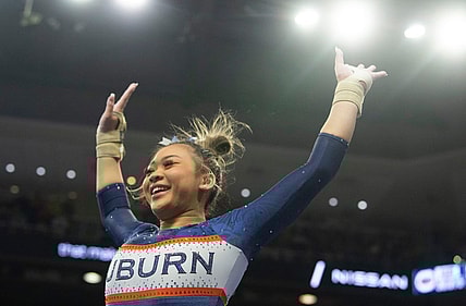 Auburn's Suni Lee reacts after her vault performance as Auburn Tigers gymnastics takes on Florida Gators at Neville Arena in Auburn, Ala., on Saturday, March 5, 2022. Auburn Tigers and Florida Gators ended in a tie at 198.575.