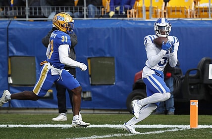 Nov 19, 2022; Pittsburgh, Pennsylvania, USA;  Duke Blue Devils wide receiver Jalon Calhoun (5) catches a touchdown pass behind Pittsburgh Panthers defensive back Erick Hallett II (31) during the first quarter at Acrisure Stadium. Mandatory Credit: Charles LeClaire-USA TODAY Sports
