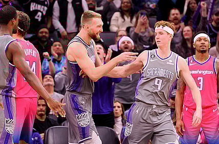 Dec 23, 2022; Sacramento, California, USA; Sacramento Kings power forward Domantas Sabonis (10) celebrates with shooting guard Kevin Huerter (9) after a play against the Washington Wizards during the fourth quarter at Golden 1 Center. Mandatory Credit: Kelley L Cox-USA TODAY Sports
