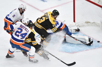 May 31, 2021; Boston, Massachusetts, USA; Boston Bruins center Charlie Coyle (13) scores a goal past New York Islanders goaltender Semyon Varlamov (40) during the first period in game two of the second round of the 2021 Stanley Cup Playoffs at TD Garden. Mandatory Credit: Bob DeChiara-USA TODAY Sports
