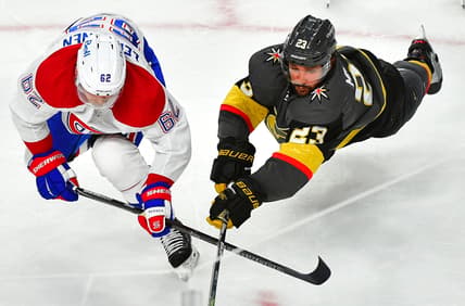 Jun 16, 2021; Las Vegas, Nevada, USA;Vegas Golden Knights defenseman Alec Martinez (23) dives to tip a puck away from the reach of Montreal Canadiens left wing Artturi Lehkonen (62) during the second period of game two of the 2021 Stanley Cup Semifinals at T-Mobile Arena. Mandatory Credit: Stephen R. Sylvanie-USA TODAY Sports