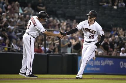 Jul 19, 2021; Phoenix, Arizona, USA; Arizona Diamondbacks first baseman Pavin Smith (26) celebrates with third base coach Tony Perezchica (3) after hitting a home run against the Pittsburgh Pirates in the second inning at Chase Field. Mandatory Credit: Rick Scuteri-USA TODAY Sports