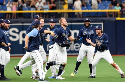 Jul 21, 2021; St. Petersburg, Florida, USA; Tampa Bay Rays designated hitter Austin Meadows (17) celebrates with teammates after hitting a walk-off single in the ninth inning against the Baltimore Orioles at Tropicana Field. Mandatory Credit: Jonathan Dyer-USA TODAY Sports