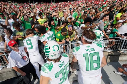 Oregon Ducks fans celebrate with players following their 35-28 win over the Ohio State Buckeyes in the NCAA football game at Ohio Stadium in Columbus on Saturday, Sept. 11, 2021.

Oregon Ducks At Ohio State Buckeyes Football