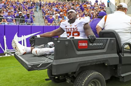 Oct 2, 2021; Fort Worth, Texas, USA; Texas Longhorns offensive lineman Denzel Okafor (78) leaves the game on a cart during the first half against the TCU Horned Frogs at Amon G. Carter Stadium. Mandatory Credit: Kevin Jairaj-USA TODAY Sports