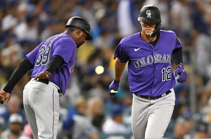 Oct 4, 2022; Los Angeles, California, USA; Colorado Rockies left fielder Sean Bouchard (12) is congratulated by third base coach Stu Cole (39) after a solo home run in the third inning against the Los Angeles Dodgers at Dodger Stadium. Mandatory Credit: Jayne Kamin-Oncea-USA TODAY Sports