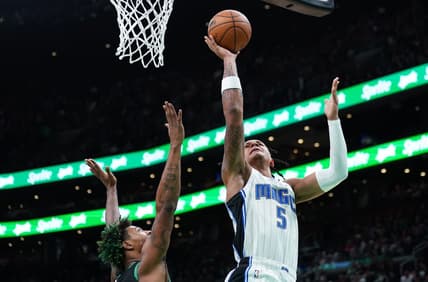 Dec 16, 2022; Boston, Massachusetts, USA; Orlando Magic forward Paolo Banchero (5) shoots againstBoston Celtics guard Marcus Smart (36) in the first quarter at TD Garden. Mandatory Credit: David Butler II-USA TODAY Sports